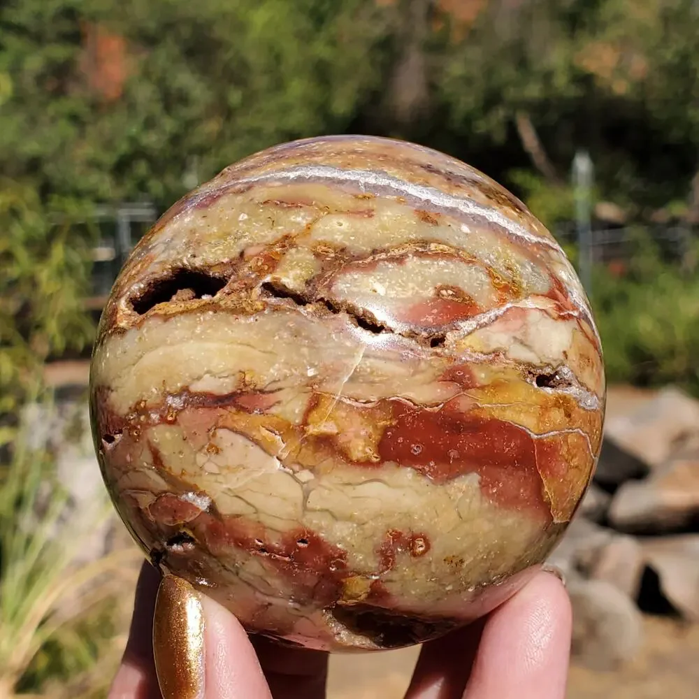 Pink Ocean Ibis Jasper Brecciated Sphere w/ Caves Druzy 458 grams 71mm